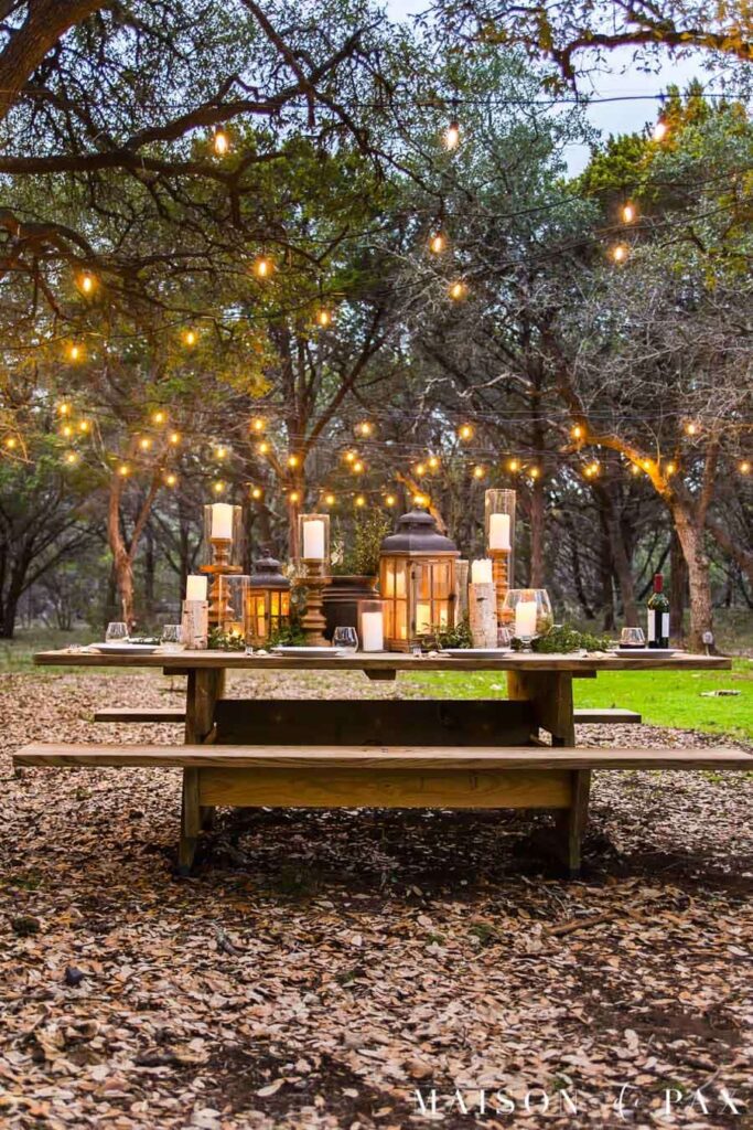 rustic dining table garden party outdoor wedding ideas string lights 16