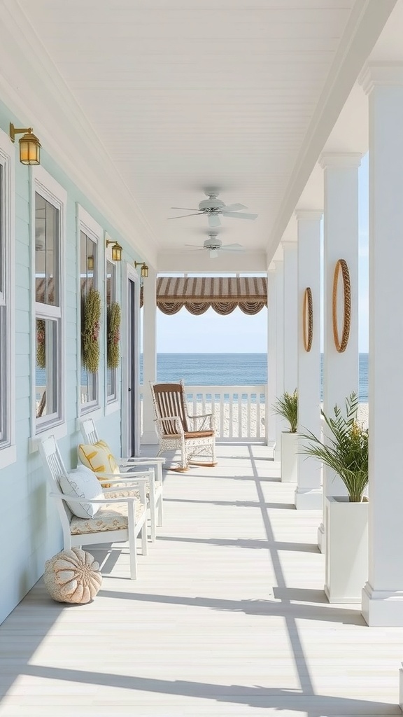 A coastal-themed porch with white furniture, light blue walls, and a view of the ocean.