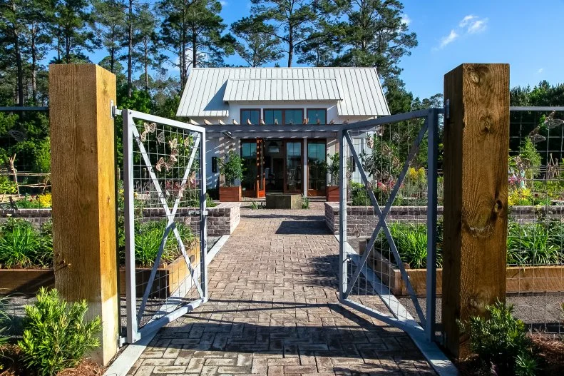 Minimalist wire and cedar frame fence