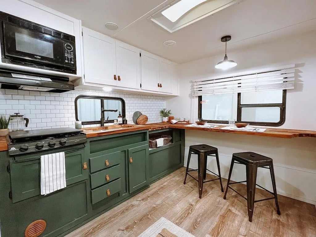 Sage green RV kitchen with bar seating