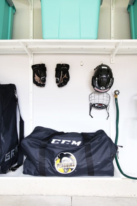 Wall mounted rack storing hockey helmets and gloves