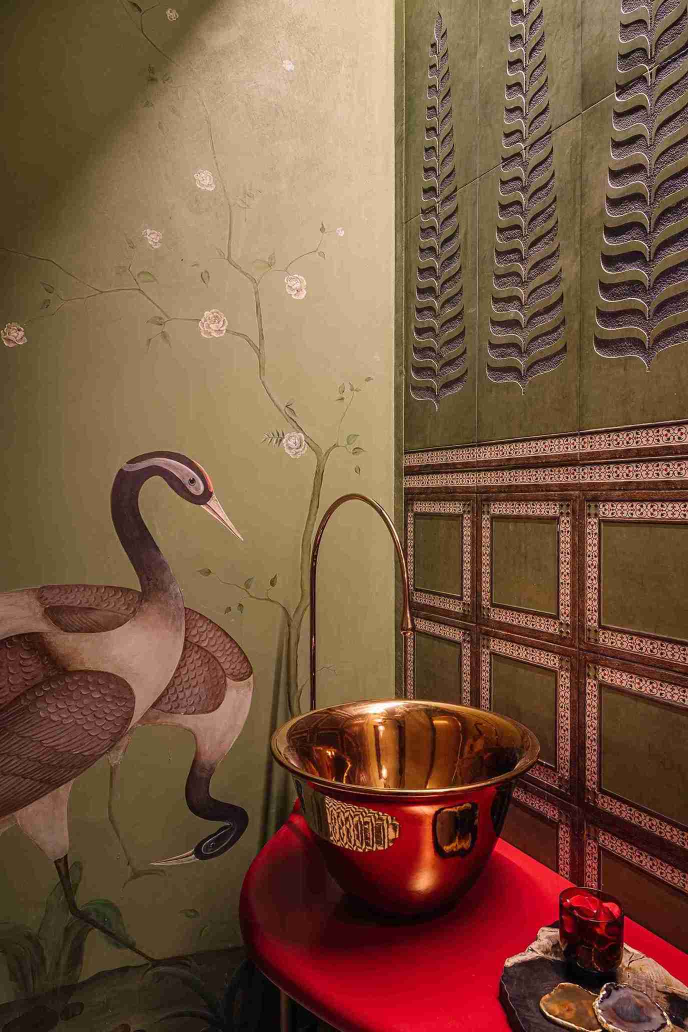 Small bathroom with thin vertical white tiles on vanity wall, floating wood vanity, circular mirror, dark accent tile wall, and a minimalist pendant light.