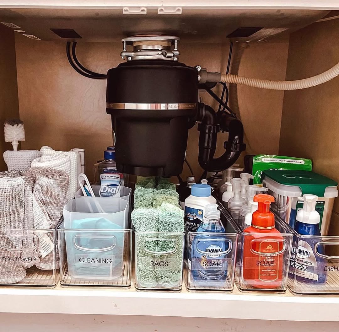 Custom wooden drawers built around plumbing under bathroom sink